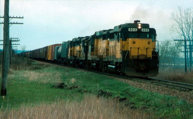 GP30  803  No. Fond du Lac, WI
GP 30 803 leading a freight train north of North Fond du Lac in April 1976.  Bob Ferge photo, J. D, Ingles collection. Submitted by J. H. Yanke.
Keywords: GP30