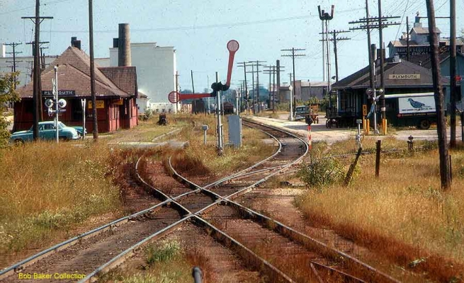 Depot  Plymouth, WI
Plymouth is on the line between Sheboygan and Fond du Lac.  The CNW depot is on the left, the Milwaukee Road on the right.  The crossing of the railroads is protected by a �smash-board signal.�  Photo taken 9-1963.  Collection of Bob Baker.

Keywords: depot Plymouth