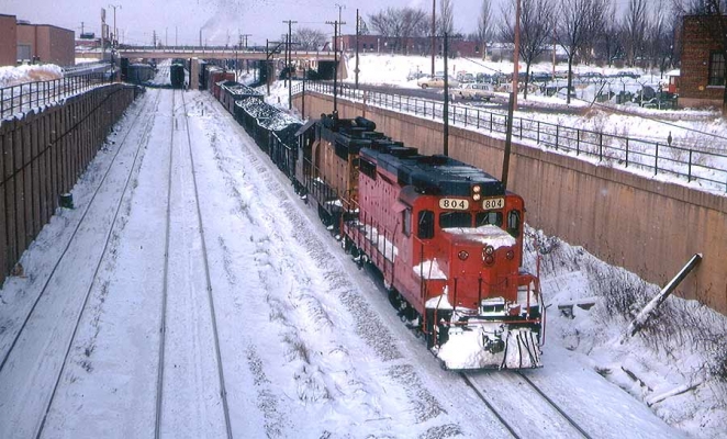 GP30  804  Milwaukee, WI
Ex-CGW GP30 804 is eastbound at Mitchell Yard on its way to St. Francis.  Then it will take either the New Line or Old Line Subdivision to Proviso or 40th St. Yard in Chicago.  Tom Hoffmann photo, 1-2-1969.
Keywords: GP30 804 Milwaukee Mitchell yard