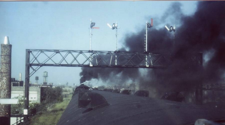 Semaphores in Steam  Chicago, IL
A signal bridge with semaphores gets dusted by ex-NKP #765 as "The Overland 400" heads West. The September 7, 1985 excursion to Sterling was sponsored by the 20th Century RR Club of Chicago.  Bill Hakkarinen photo.
Keywords: Signal Bridge  Chicago