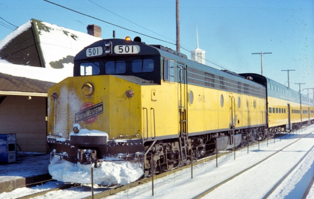 Suburban Train  E8  501  Arlington Heights, IL
C&NW E8 501, with a Crandall cab, soldiers through its weekend duties on a very cold, crisp January day in 1978.  Photographed by Mike Barton at Arlington Heights.
Keywords: E8  501  Arlington Heights, IL Crandall