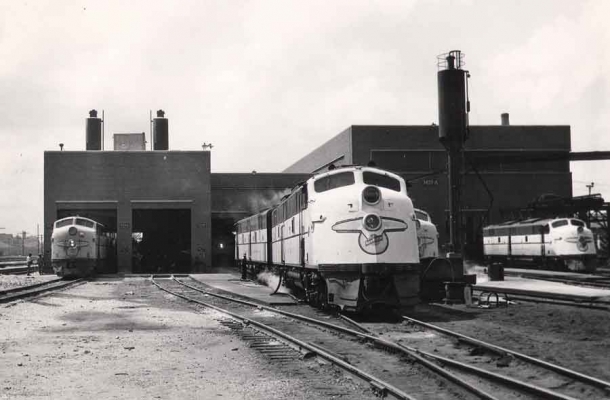 Chicago Diesel Shop  Building M19-A
Three E6�s and two E7�s are idling or being serviced on the east side of the diesel repair shop.  C&NW Public Relations Department photo.  C&NW Historical Society Archives collection.


Keywords: E6  E7  Chicago shops