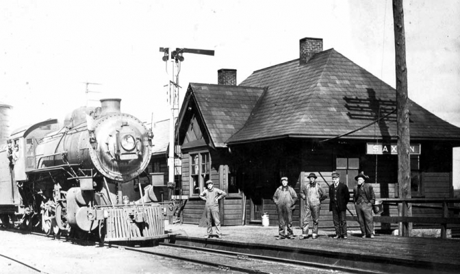 Saxon, WI
Saxon is on the line from Ashland to Hurley, 12� miles west of Hurley.  The train is waiting at the depot for �orders� to continue their trip.  C&NW Historical Society Archives collection.
Keywords: Saxon, WI