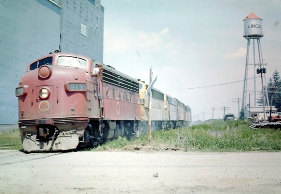 F7  215  Lincoln, IA
An Oelwein to Des Moines train heads through Lincoln, IA in late summer of 1972 with CNW(ex CGW) 215 on the point. Photo by Tom Zorko.
